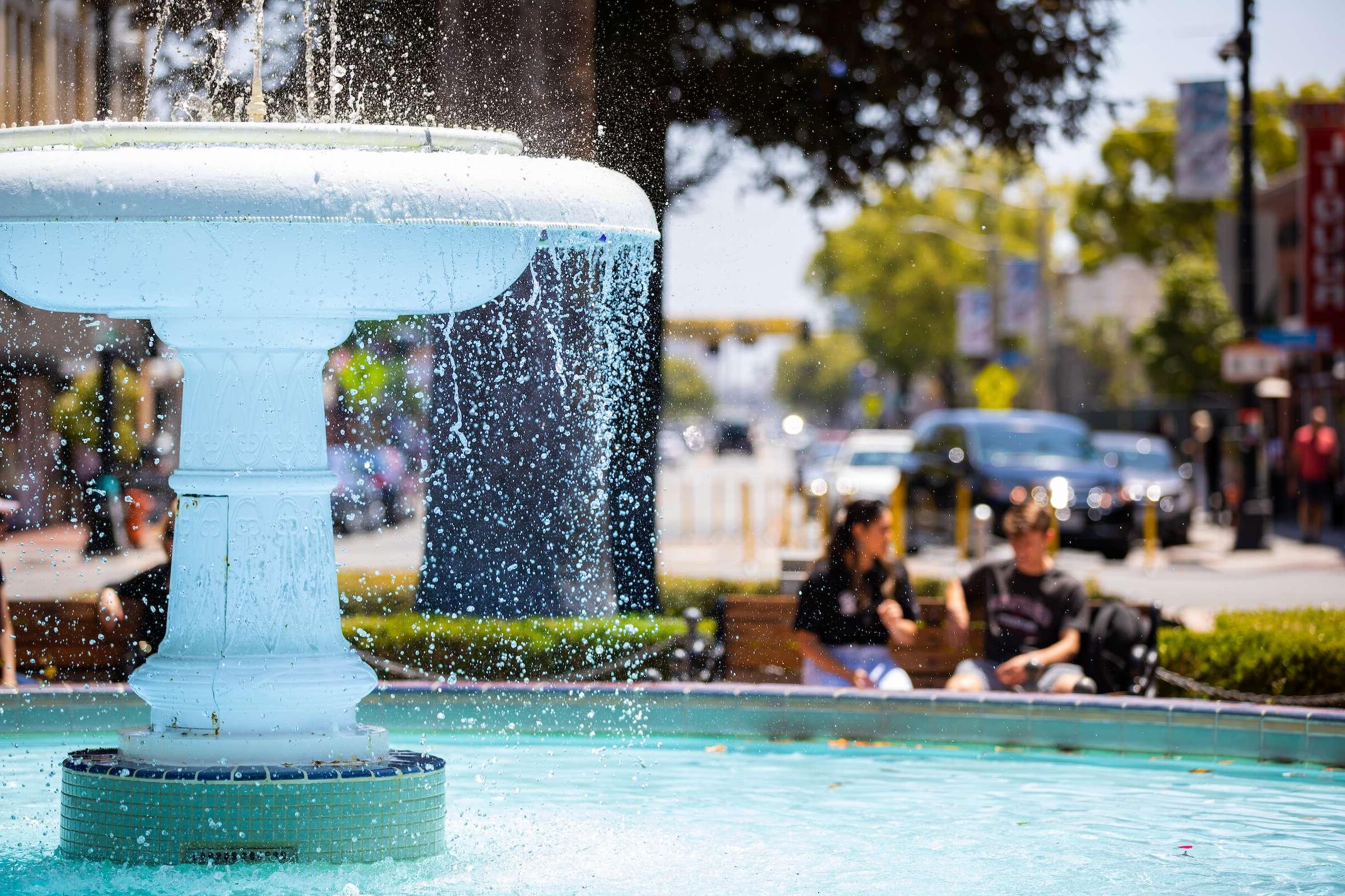 A fountain in the Orange Circle on a sunny day.