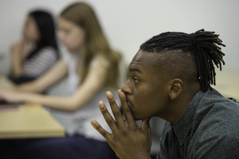 威尔金森大学 student listening intently to classmate